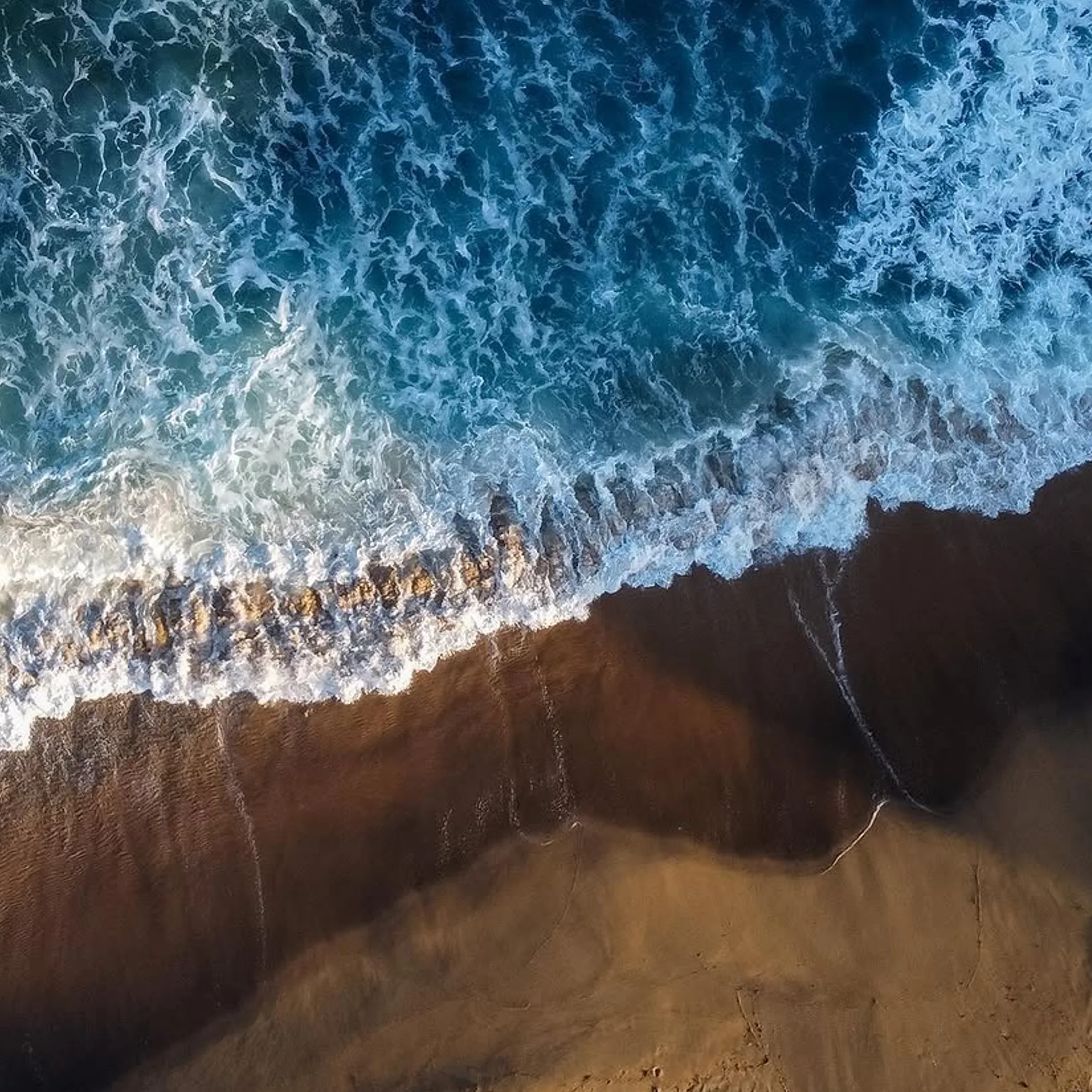 aerial view of surf and shoreline