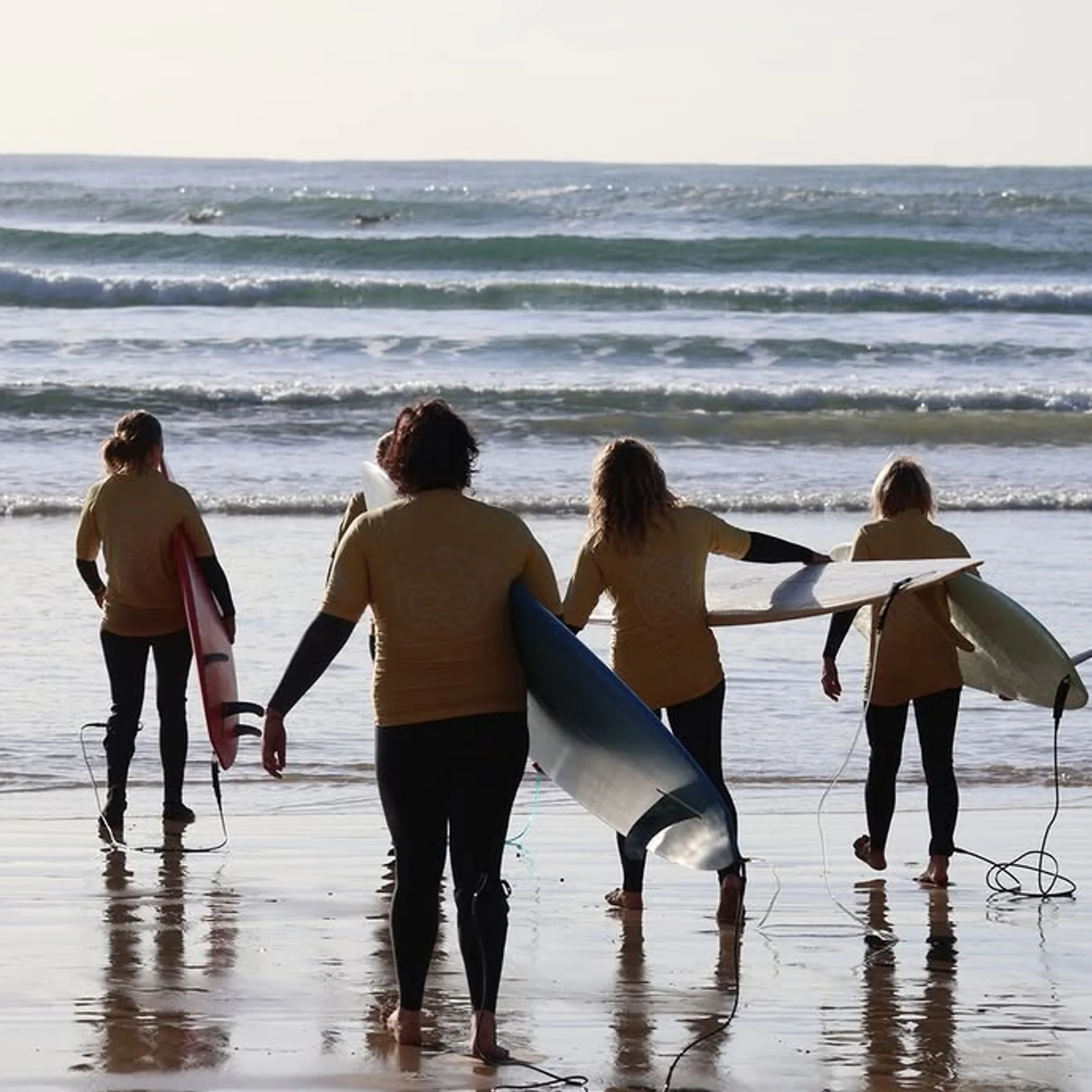 surfer riding a beach wave